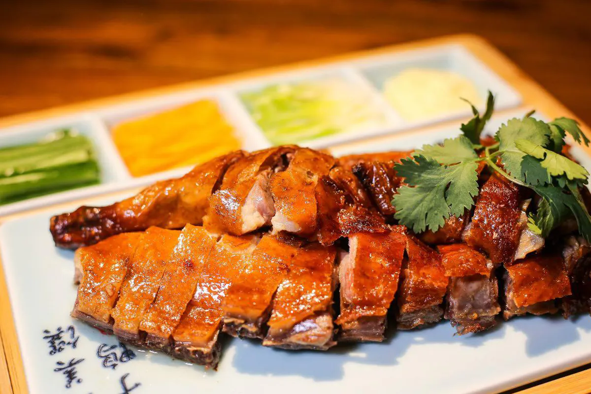 Sliced roast duck with colorful vegetable side dishes at Szechuan Gourmet, a Chinese Restaurant in New York Sliced roast duck with colorful vegetable side dishes at Szechuan Gourmet, a Chinese Restaurant in New York